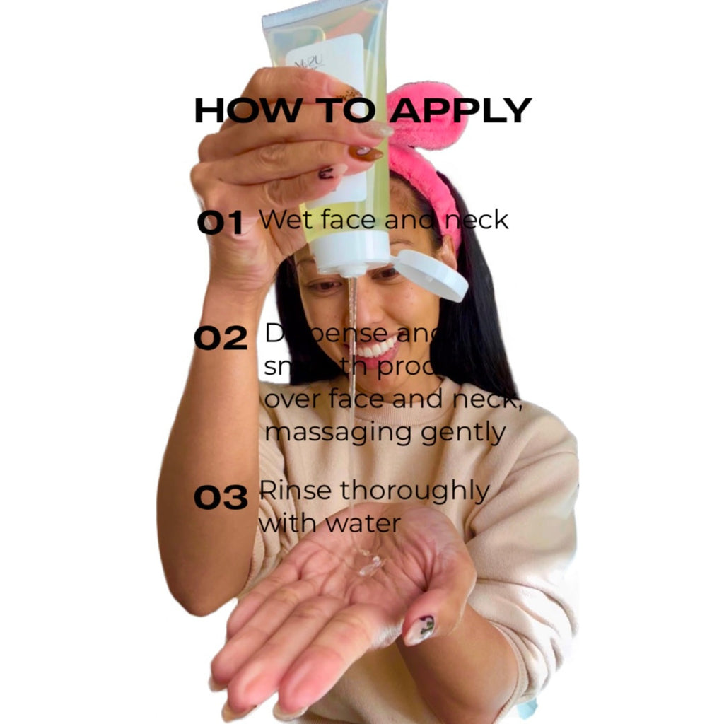 alt="Filipino Girl pouring NU Face Gelly Cleanser in her hand with a pair of pink bunny ears on her head, wearing a tan sweatshirt, and a smile on her face."
