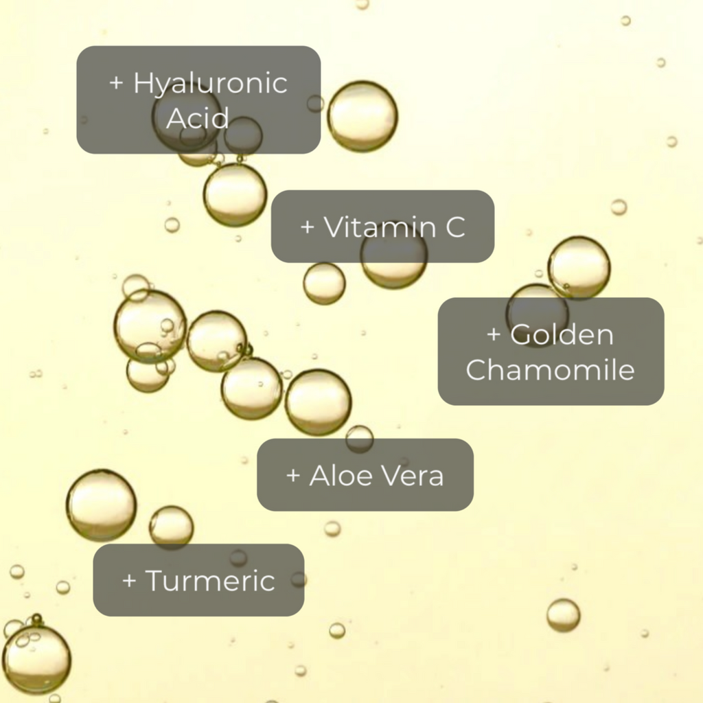 alt="Yellow colored serum bubbles large and small on yellow colored background with ingredients reading hyaluronic acid, vitamin c, golden chamomile, aloe vera, and turmeric."